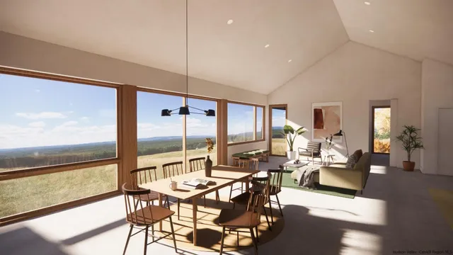 a living room with lots of furniture and large windows