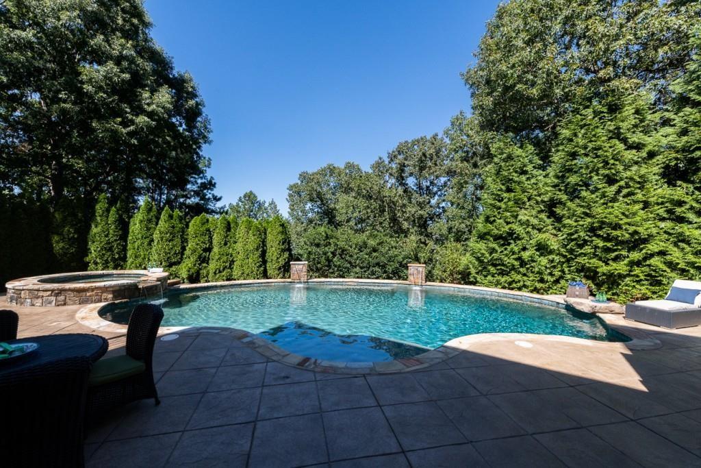 165 Autry Trail Alpharetta, GA 30022 - Photo 57 of 70 a view of backyard with swimming pool and outdoor seating
