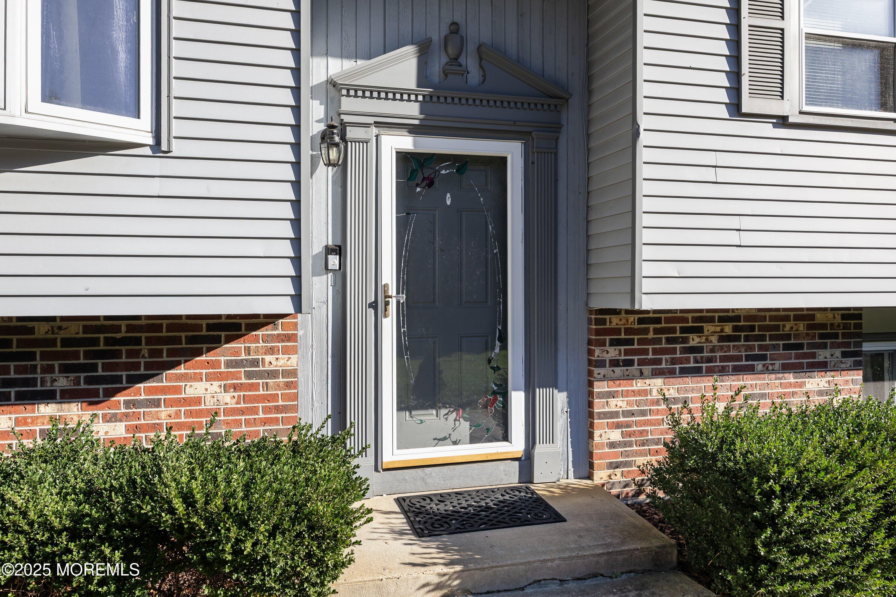 380 East Millstream Road Cream Ridge, NJ 08514 - Photo 3 of 52 a view of a door of a house with a garage
