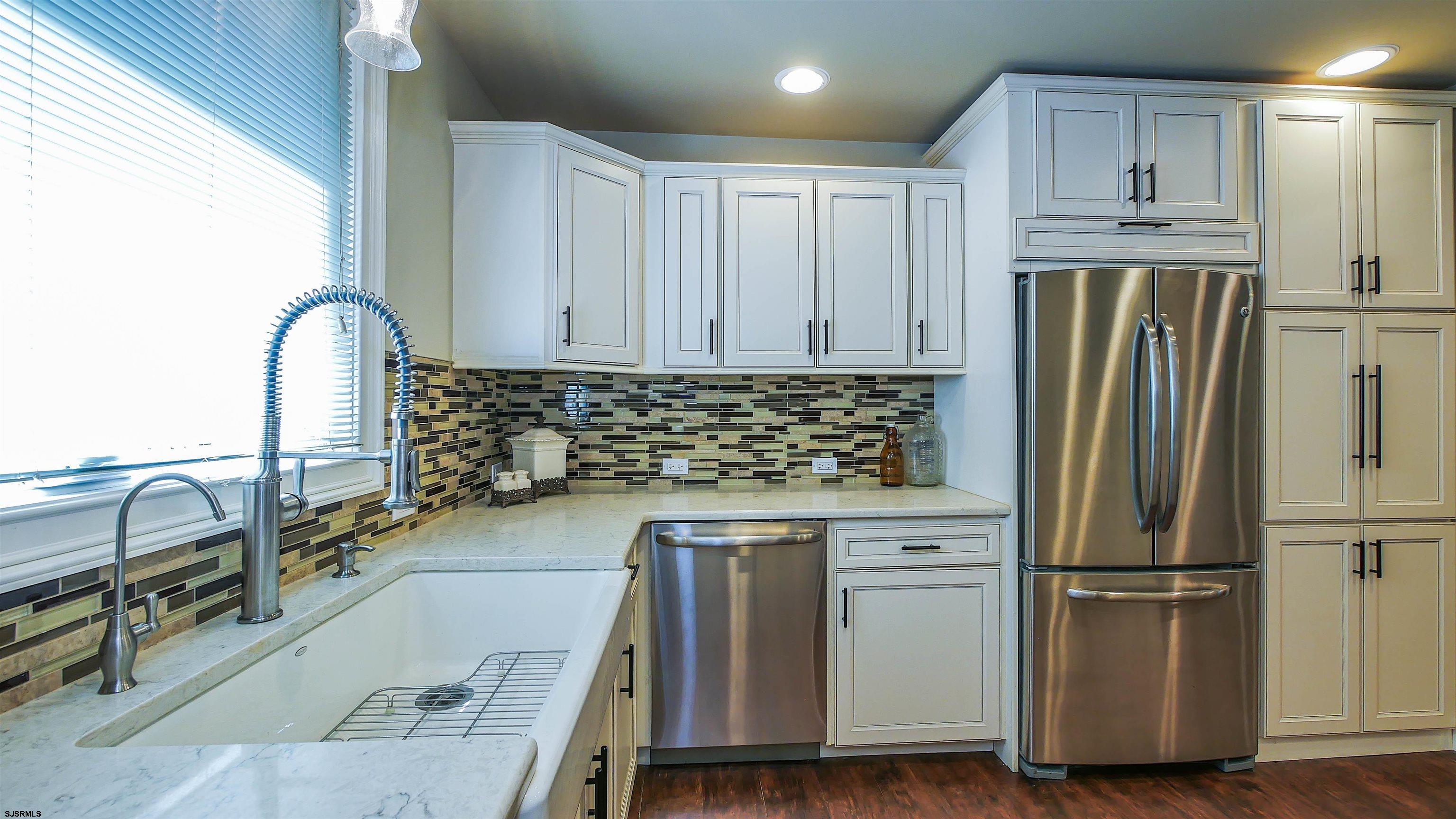 810 East Moss Mill Road Leeds Point, NJ 08205 - Photo 13 of 36 a kitchen with granite countertop a refrigerator and a sink