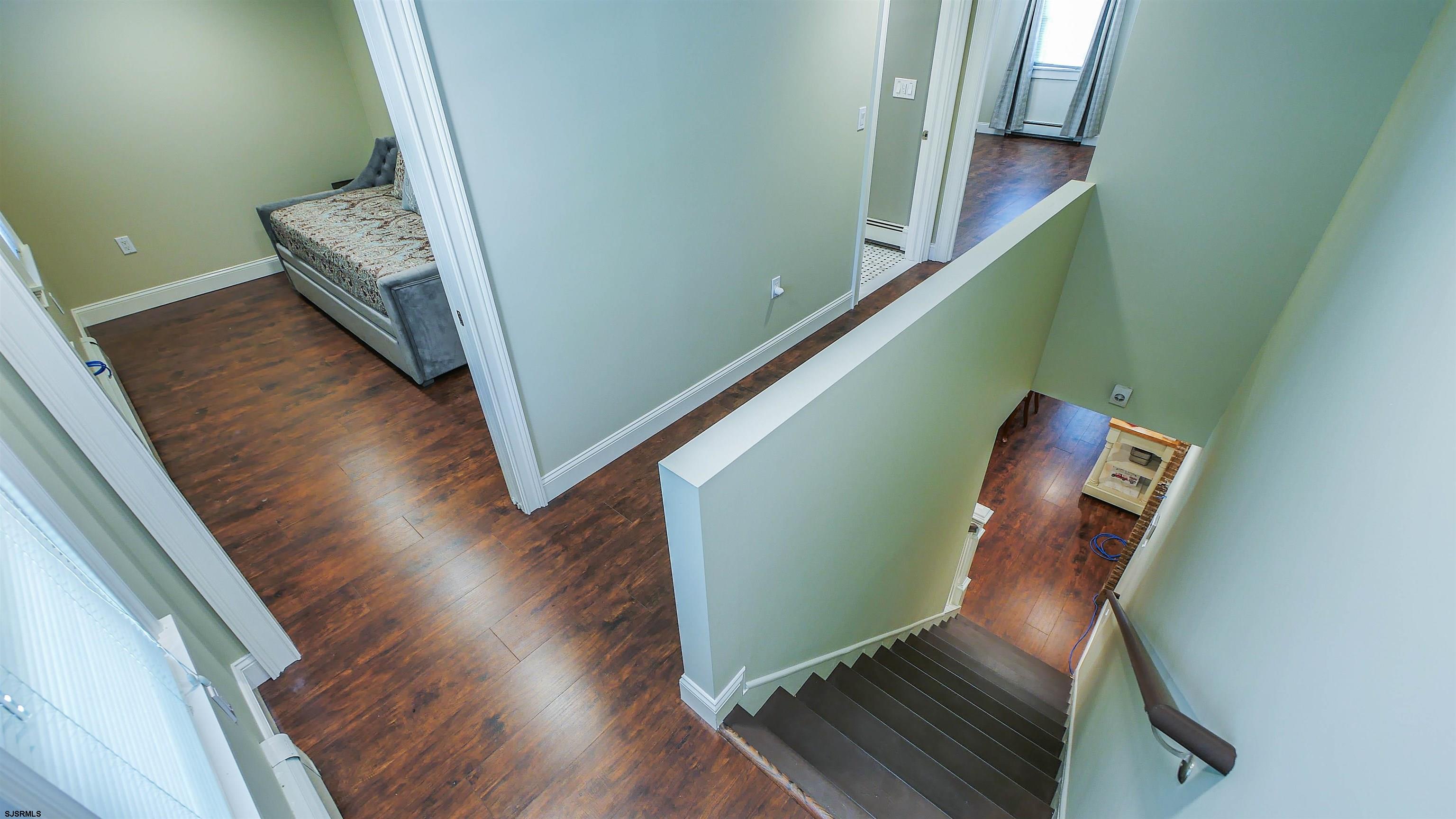 810 East Moss Mill Road Leeds Point, NJ 08205 - Photo 18 of 36 a view of a hallway with wooden floor and stairs