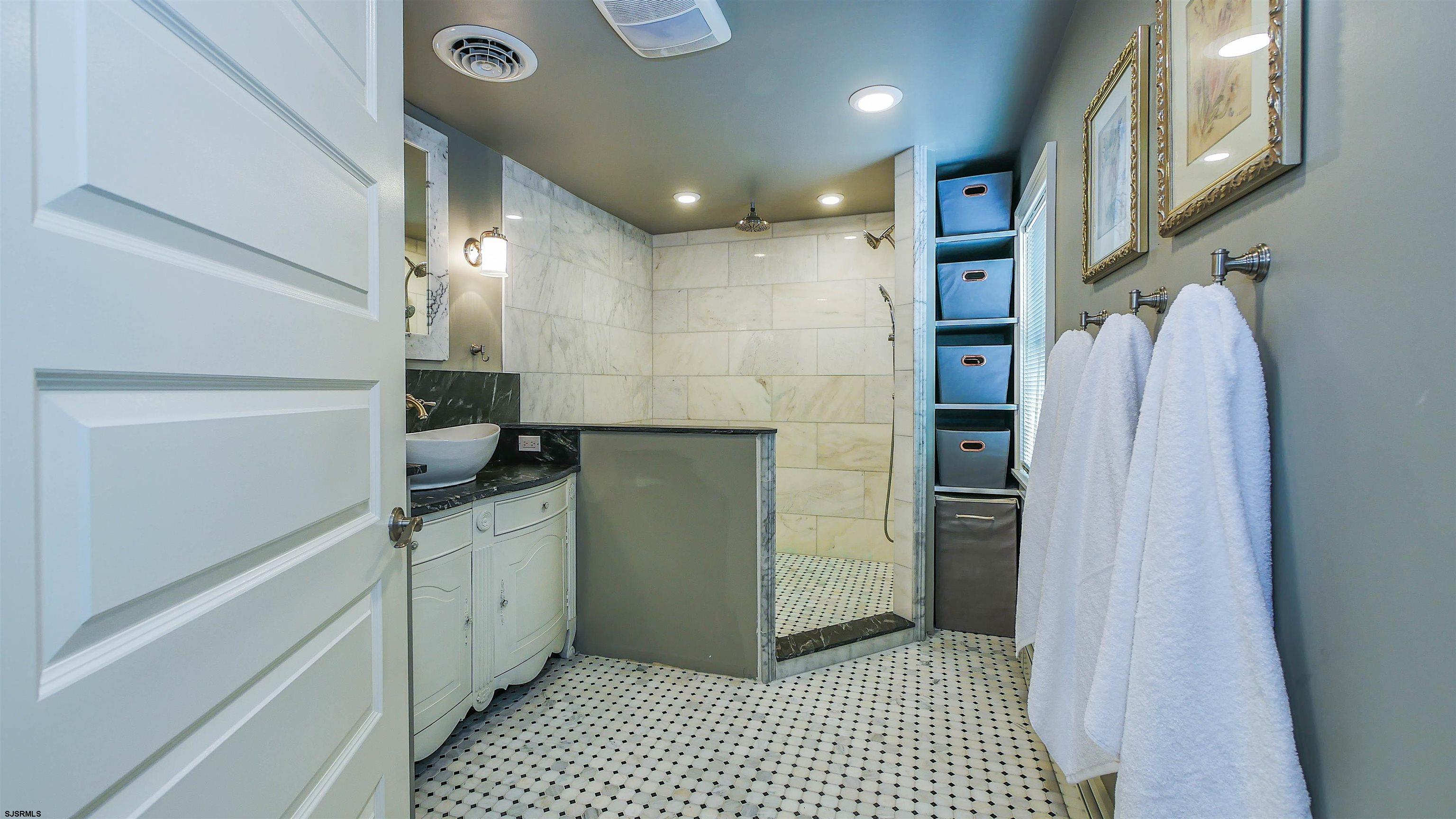 810 East Moss Mill Road Leeds Point, NJ 08205 - Photo 21 of 36 a bathroom with a shower and a sink