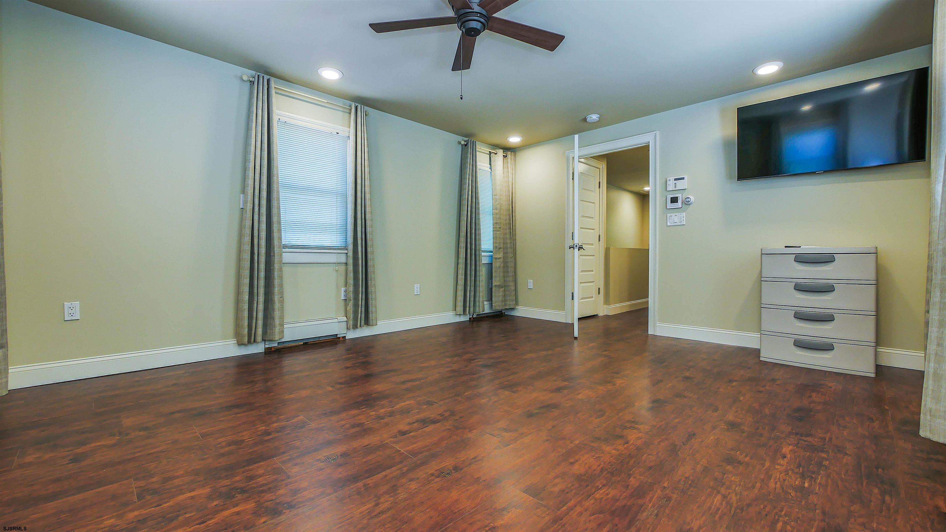810 East Moss Mill Road Leeds Point, NJ 08205 - Photo 27 of 36 a view of a livingroom with a flat screen tv