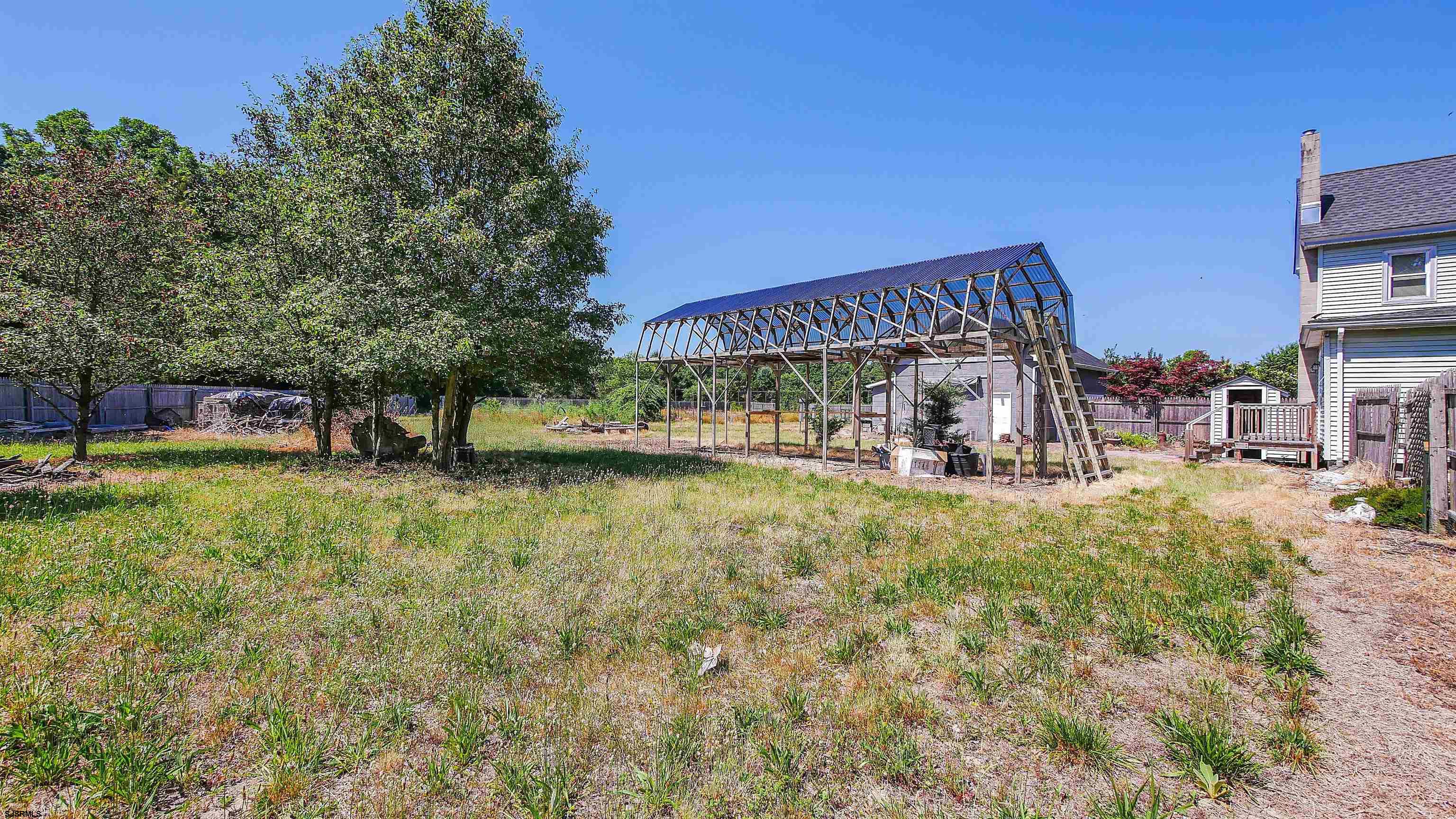 810 East Moss Mill Road Leeds Point, NJ 08205 - Photo 29 of 36 a view of a house with a yard