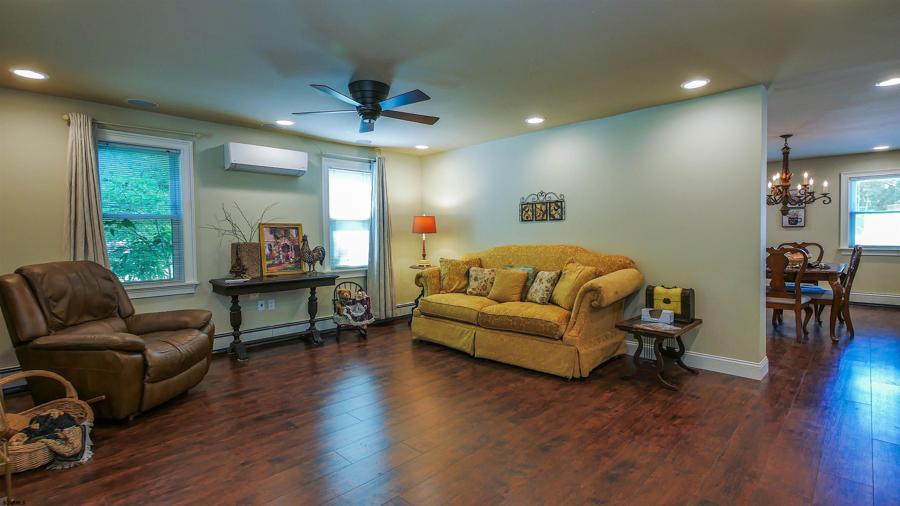810 East Moss Mill Road Leeds Point, NJ 08205 - Photo 3 of 36 a living room with furniture and a wooden floor
