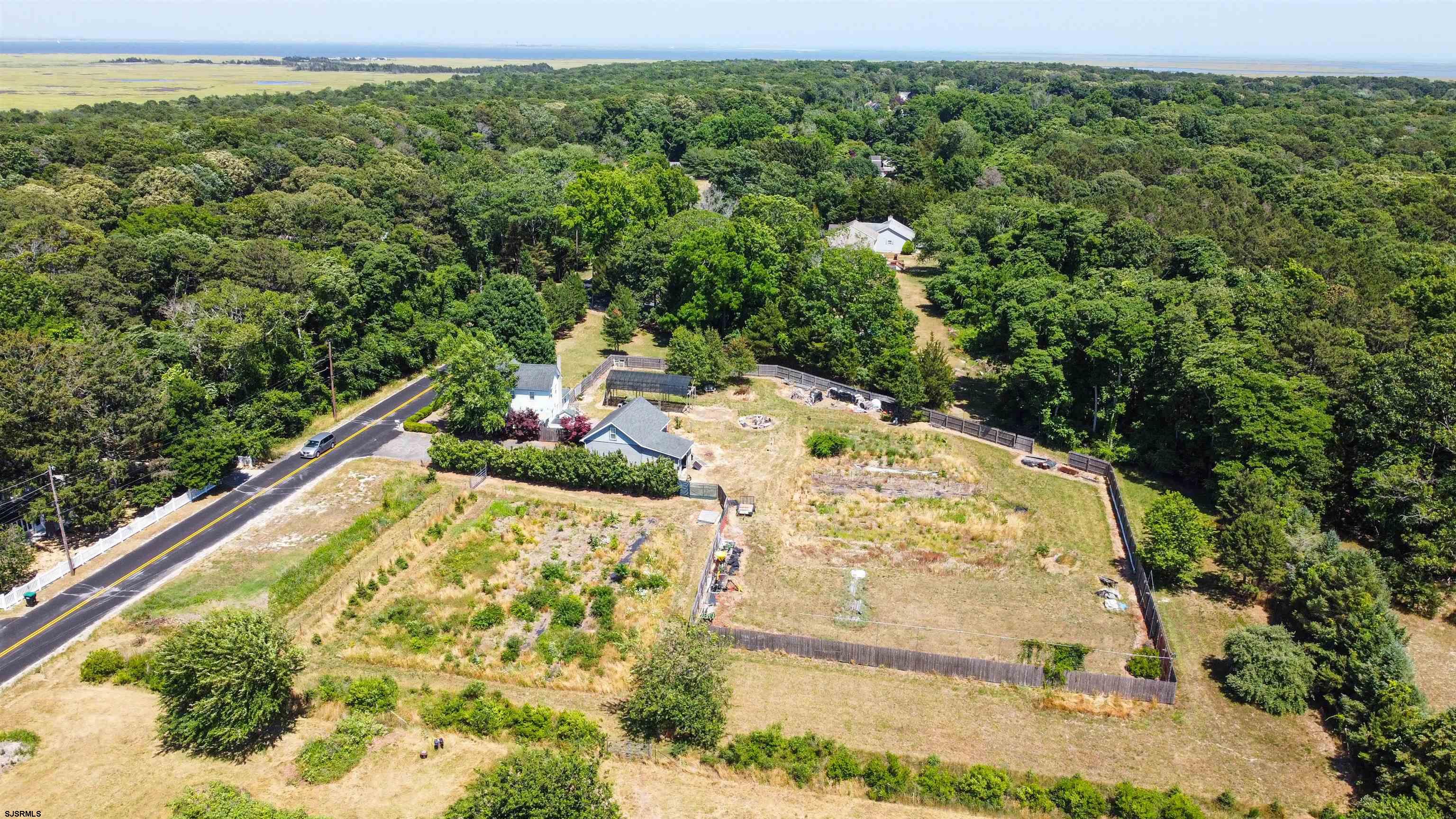 810 East Moss Mill Road Leeds Point, NJ 08205 - Photo 35 of 36 a view of a swimming pool with a yard