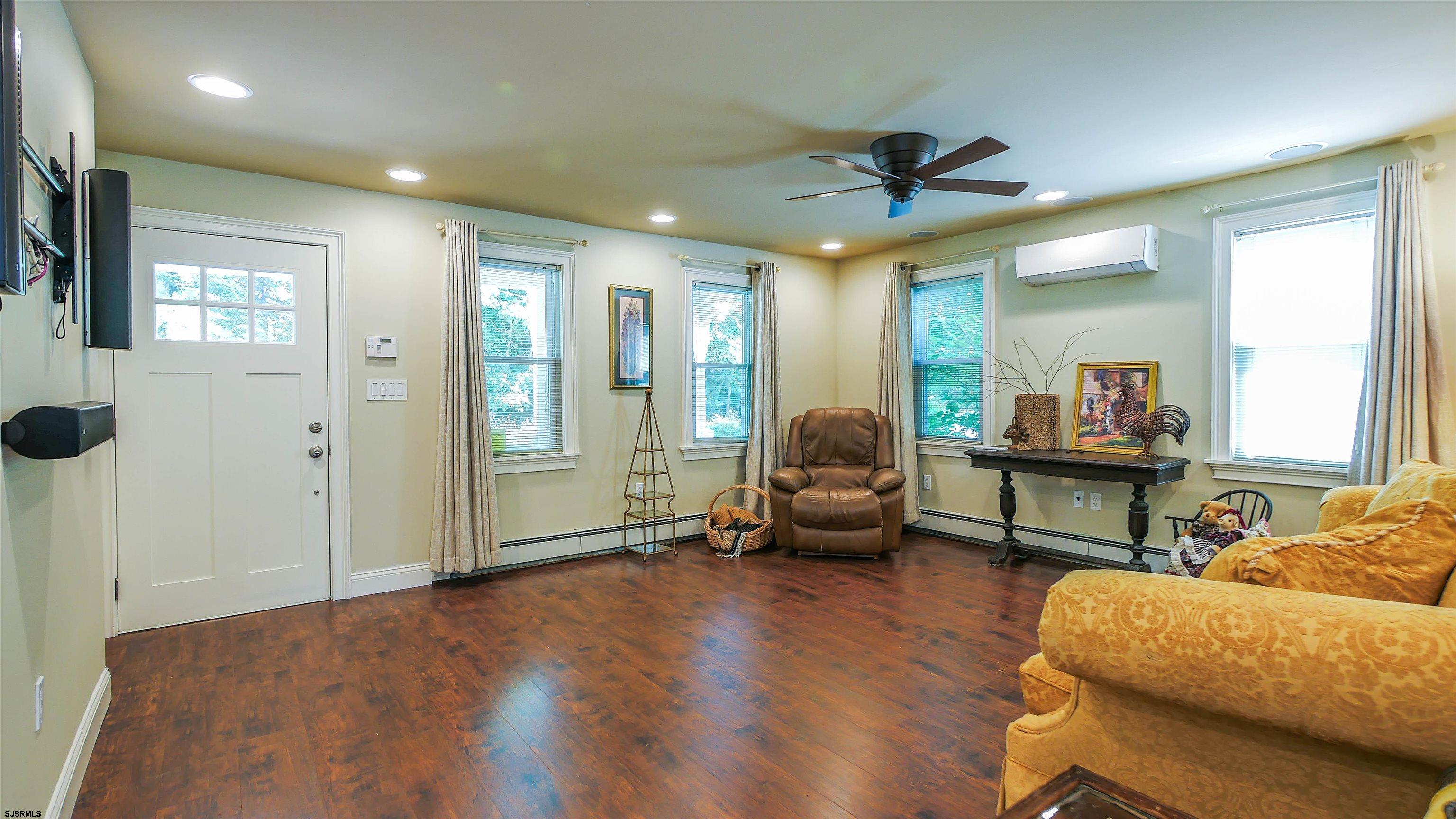 810 East Moss Mill Road Leeds Point, NJ 08205 - Photo 5 of 36 a living room with furniture and a wooden floor
