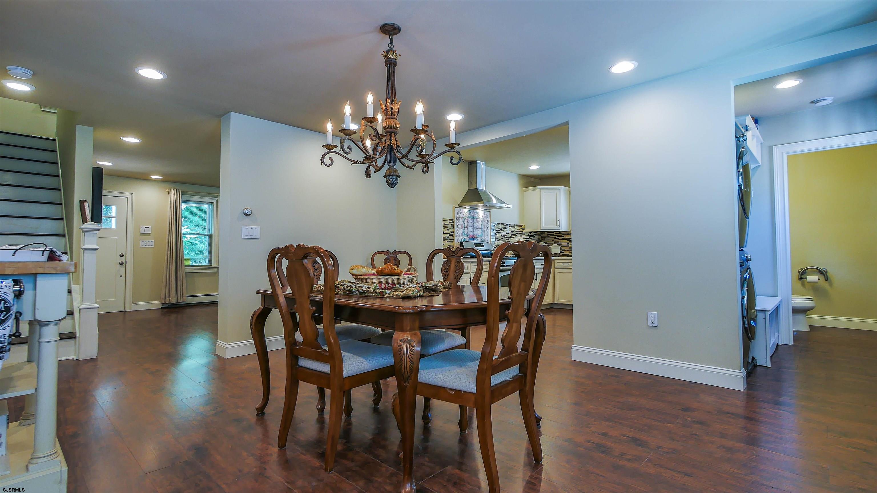 810 East Moss Mill Road Leeds Point, NJ 08205 - Photo 6 of 36 a view of a dining room with furniture and wooden floor