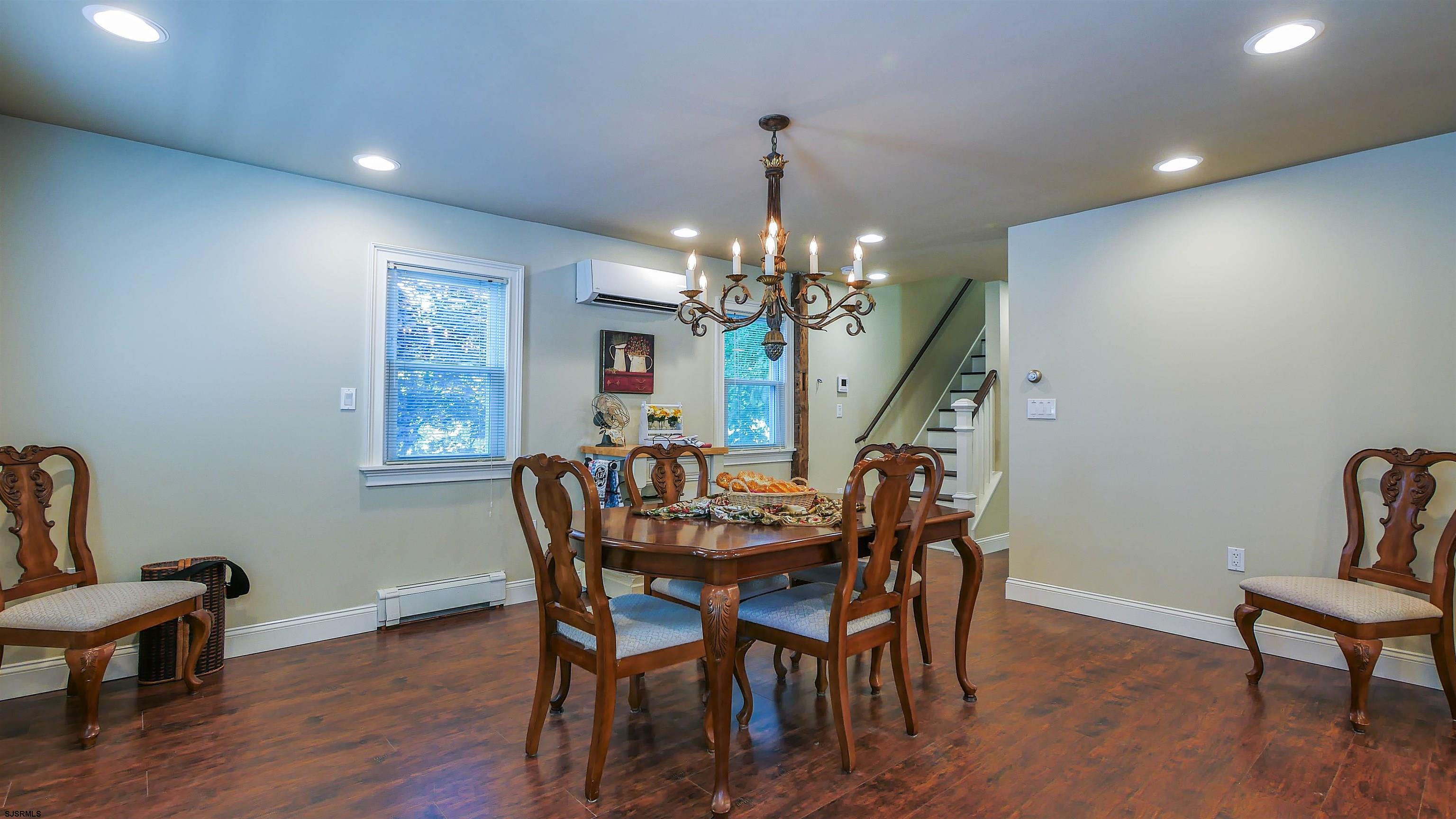 810 East Moss Mill Road Leeds Point, NJ 08205 - Photo 8 of 36 a view of a dining room with furniture and wooden floor