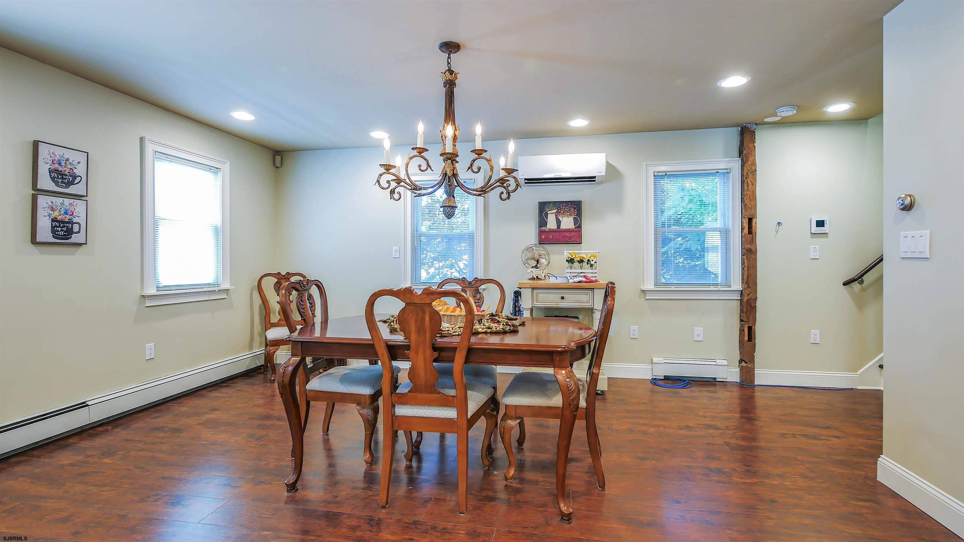 810 East Moss Mill Road Leeds Point, NJ 08205 - Photo 10 of 36 a view of a dining room with furniture wooden floor and chandelier