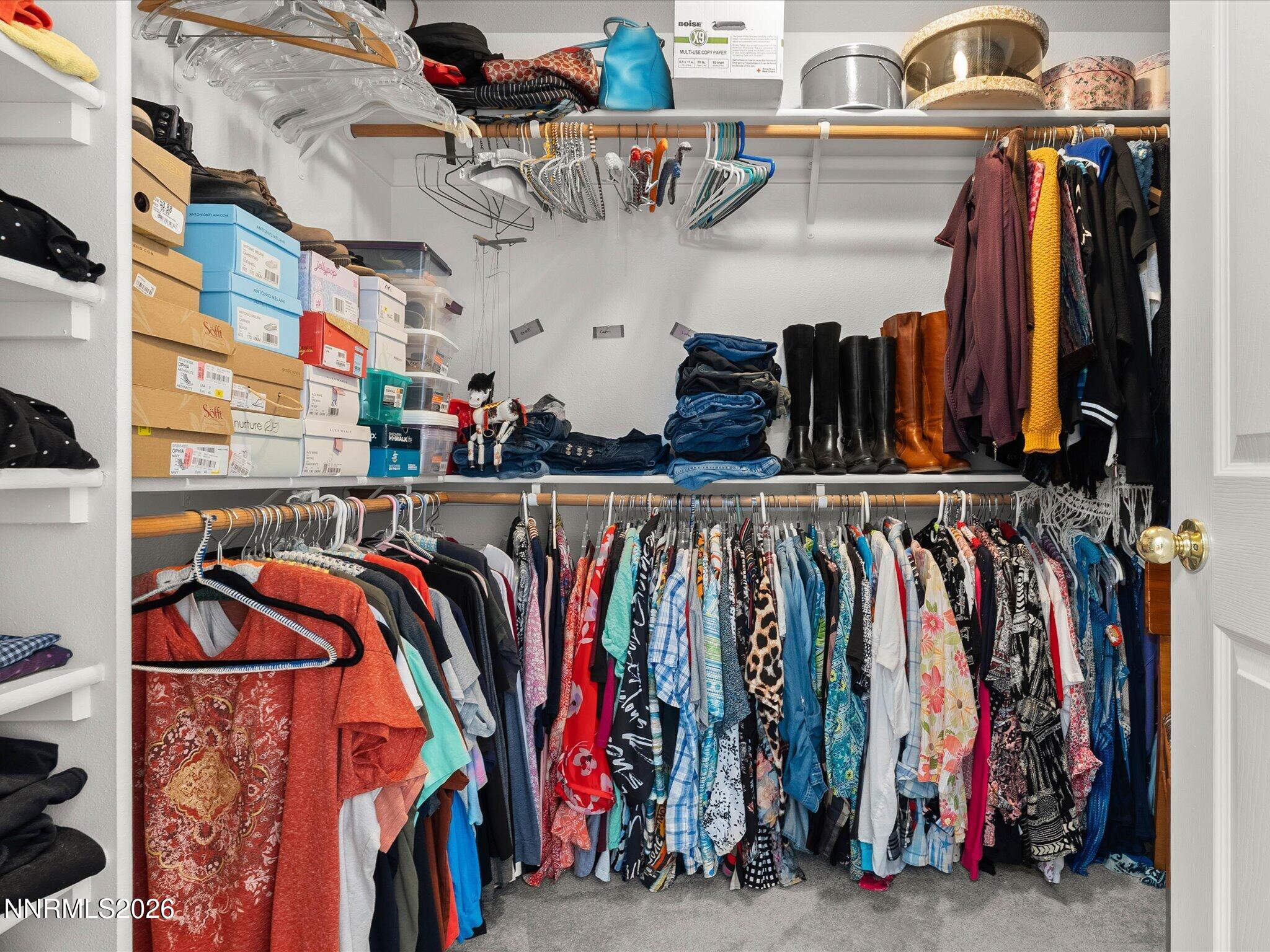1080 Red Rock Road Fernley, NV 89408 - Photo 26 of 45 a view of walk in closet with clothes and shoes
