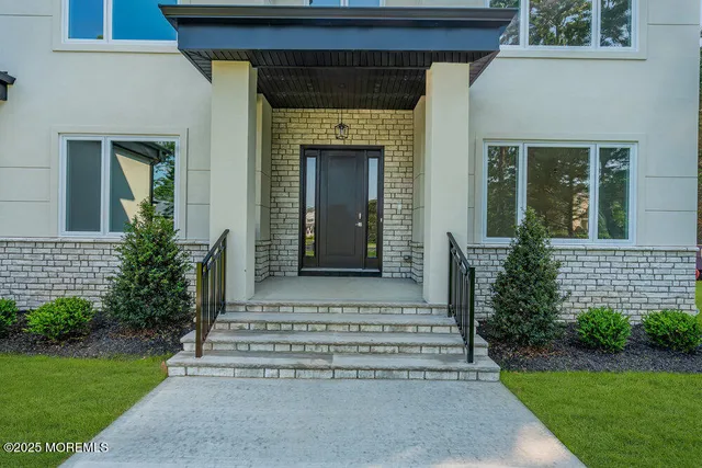 a kitchen with a sink a stove and cabinets