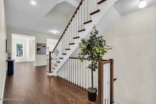 a living room with furniture and floor to ceiling window