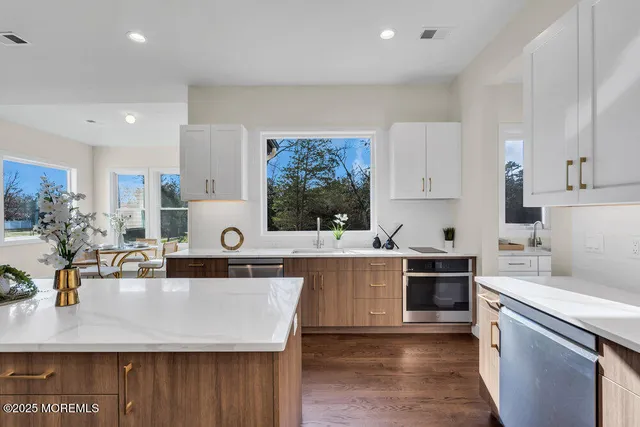a bathroom with a double vanity sink and mirror