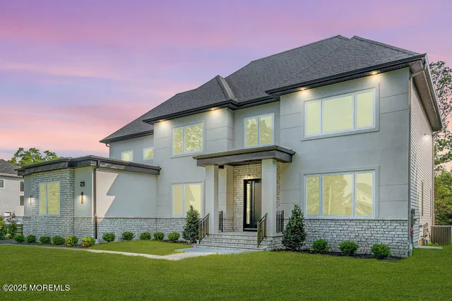 a front view of a house with a yard table and chairs
