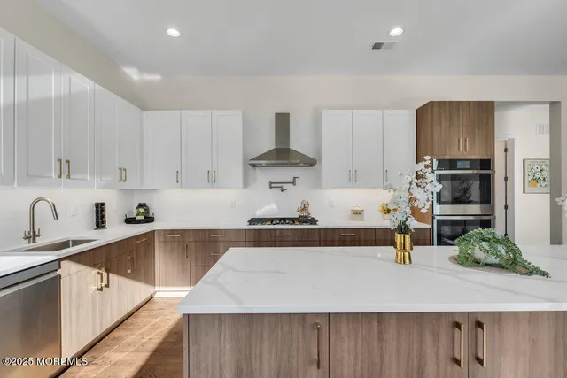 a bathroom with a sink and cabinets