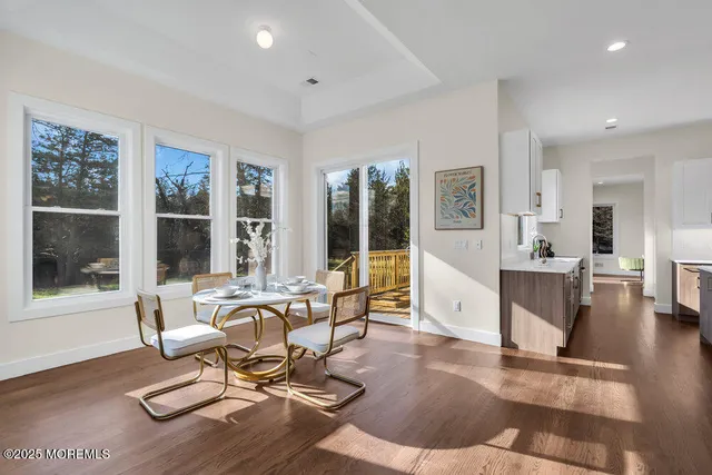 a view of balcony with wooden floor and fence