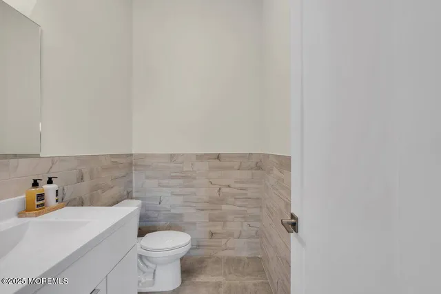 a aerial view of a house with a yard table and chairs