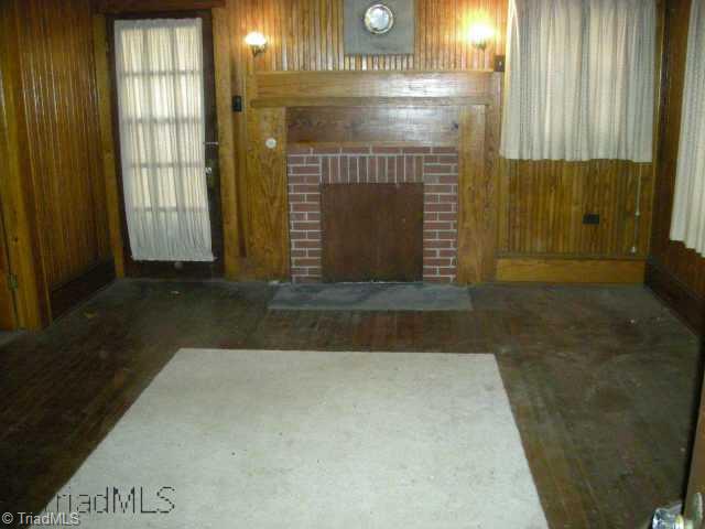 6490 Walnut Cove Road Walkertown, NC 27051 - Photo 2 of 4 Other. Living room showing fireplace