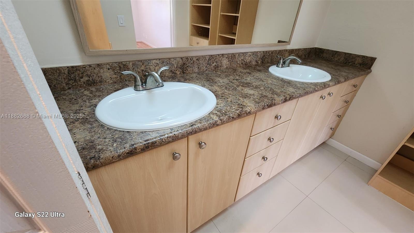 3607 Lime Hill Road, Unit 195 Lauderhill, FL 33319 - Photo 7 of 15 a bathroom with a granite countertop sink and a mirror