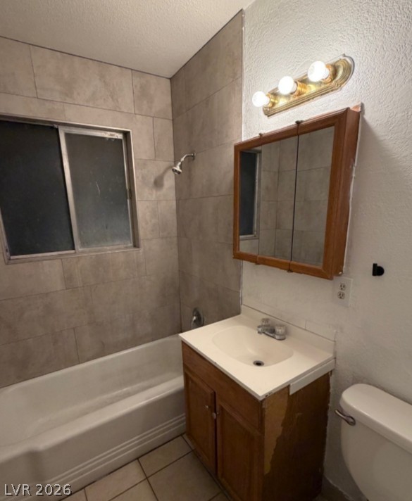 521 North Decatur Boulevard, Unit B Las Vegas, NV 89107 - Photo 8 of 17 A well-appointed bathroom offers a convenient vanity and bathtub with tiled surround.