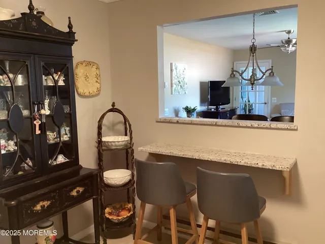 a kitchen with a table and chairs in it