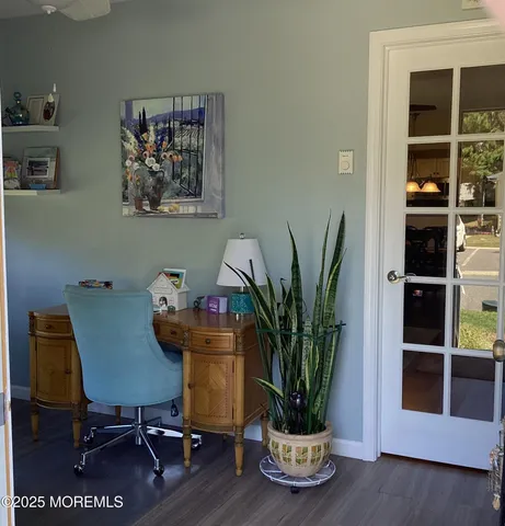a view of a workspace with furniture and with potted plant