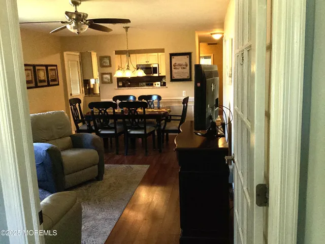 a living room with lots of furniture and a chandelier