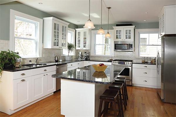 10 Milton Road Brookline, MA 02445 - Photo 3 of 7 a kitchen with granite countertop a sink appliances cabinets and furniture