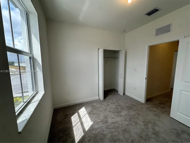 a view of an empty room and window