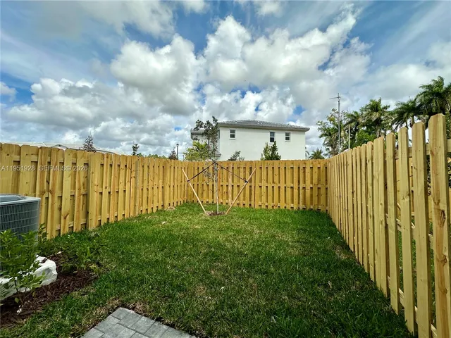 a view of a garden with pathway