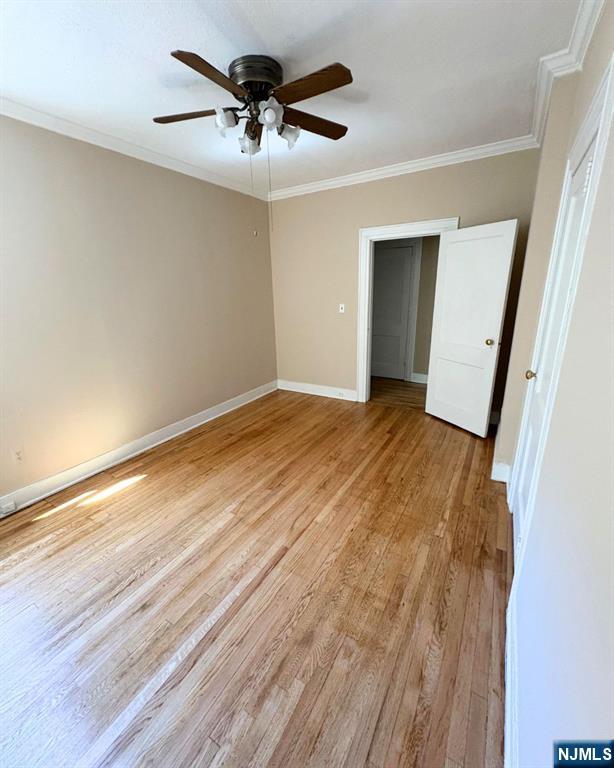 38 River Edge Road, Unit 40B River Edge, NJ 07661 - Photo 6 of 11 a view of a big room with wooden floor and a chandelier fan