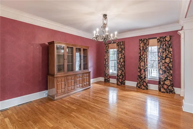 a view of large windows with wooden floor