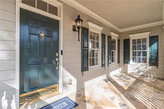 a view of a balcony with a floor to ceiling window