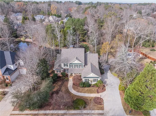 an aerial view of a house with garden space and houses