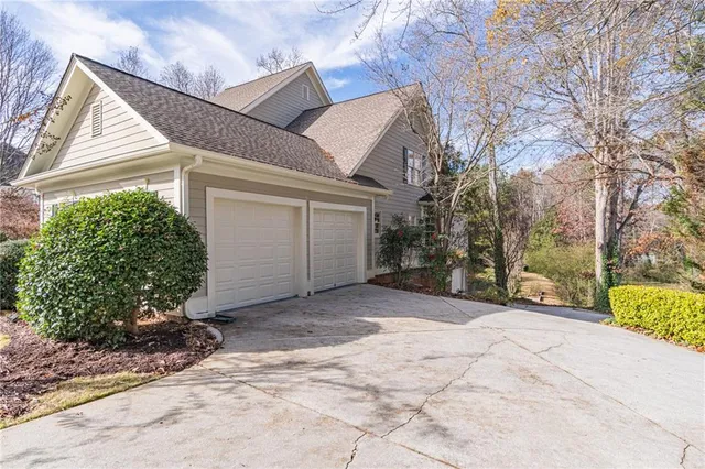 a view of a house with a yard and plant