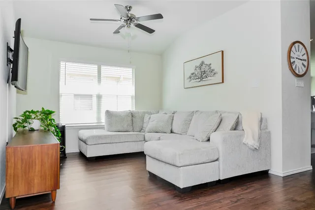 a living room with furniture and a large window