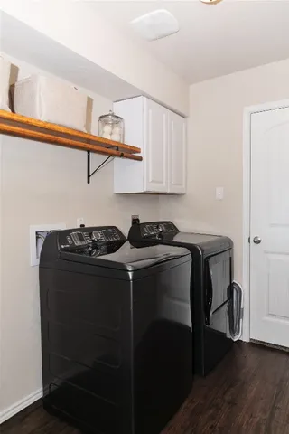 a view of storage and utility room with washer and dryer