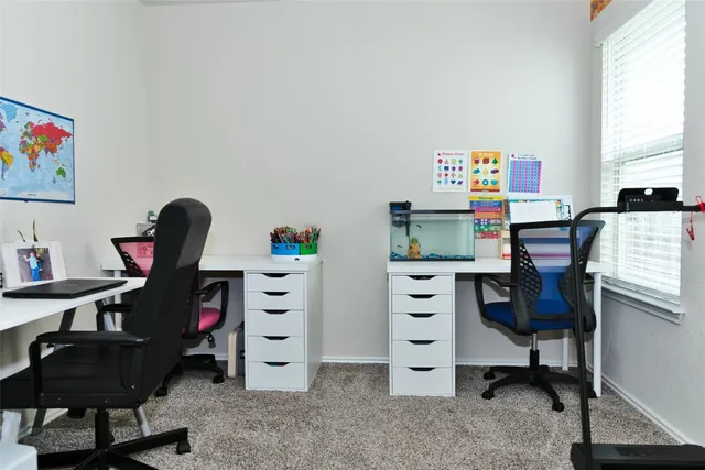 a view of workspace with lounge chair