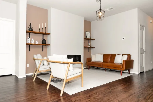 a view of a livingroom with furniture and wooden floor