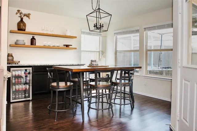 a dining room with wooden floor and breakfast area