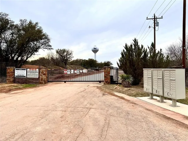 a view of a street with a building in the background