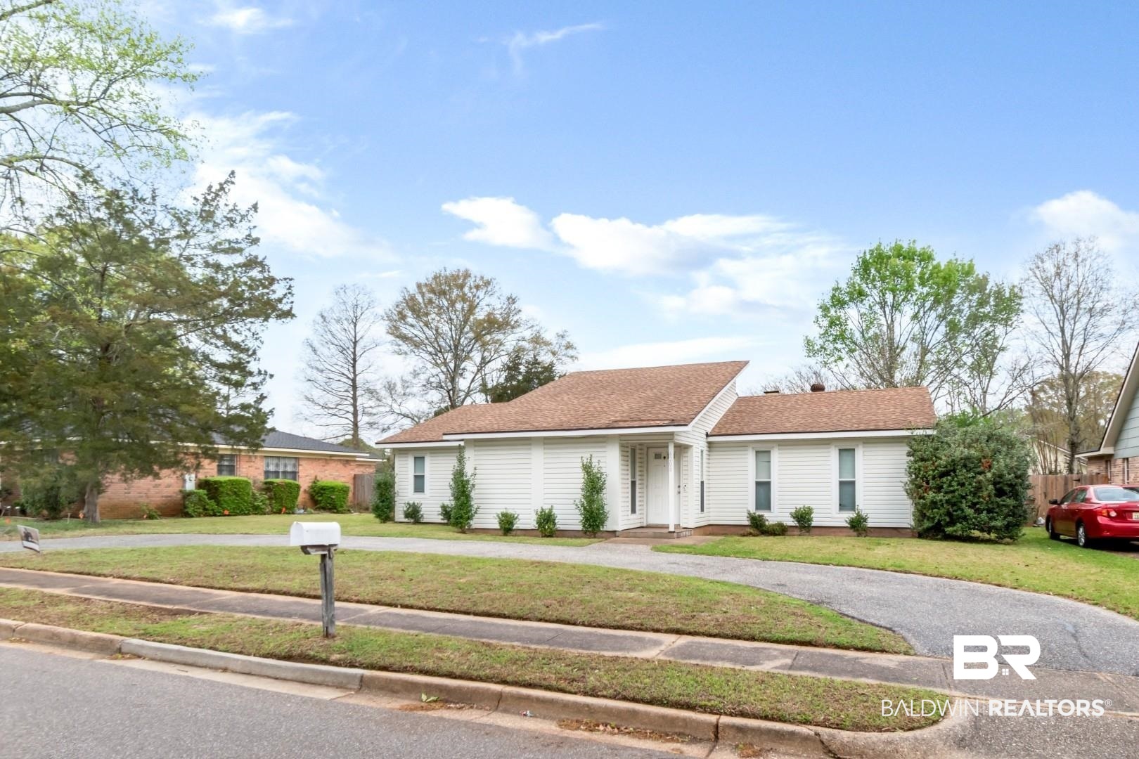 6208 Cottage Hill Road Mobile, AL 36609 - Photo 2 of 20 Ranch-style house with a shingled roof and a front lawn