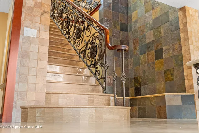 a bathroom with a sink mirror and vanity