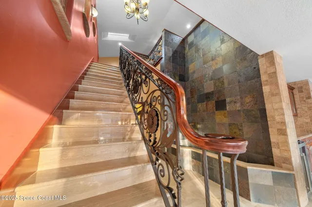 a living room with stainless steel appliances kitchen island granite countertop furniture and a kitchen view
