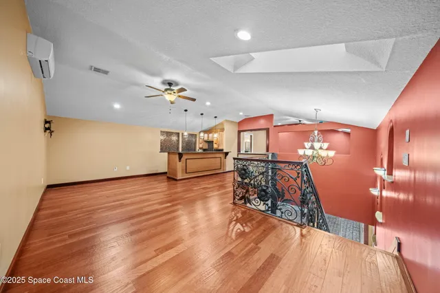 a spacious bathroom with a double vanity sink a mirror a shower and bathtub