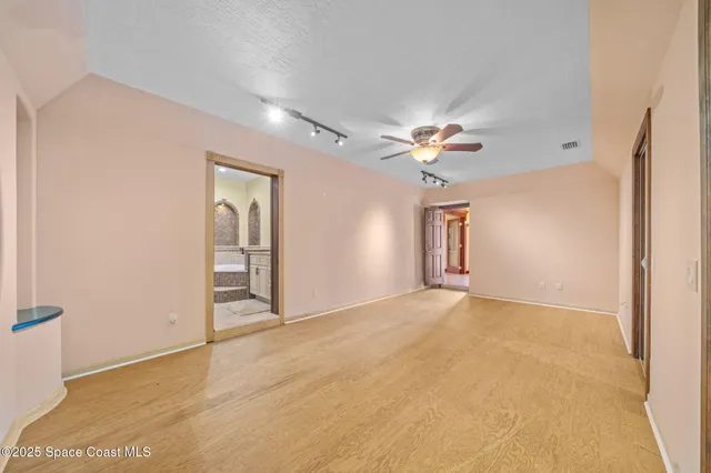 an aerial view of residential houses with outdoor space and swimming pool