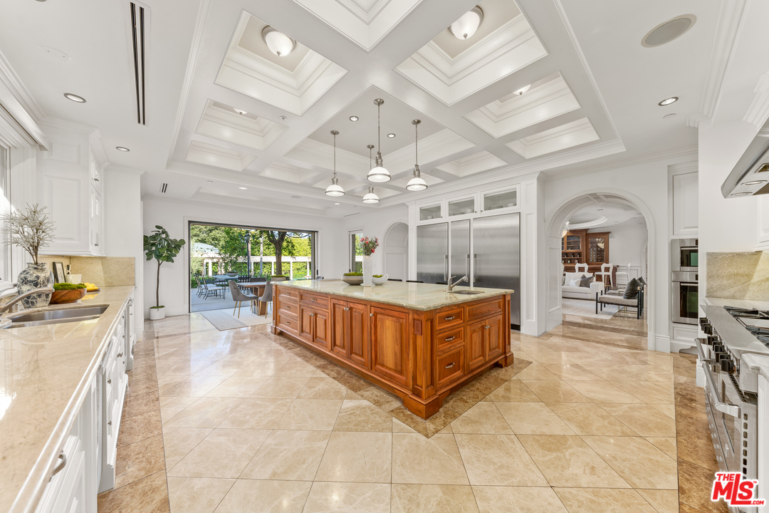 210 North Rockingham Avenue Los Angeles, CA 90049 - Photo 17 of 50 a large spacious bathroom with a large tub and sink