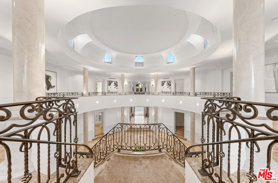 210 North Rockingham Avenue Los Angeles, CA 90049 - Photo 21 of 50 a view of a porch with wooden floor