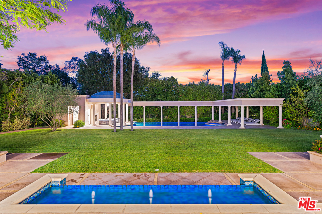 210 North Rockingham Avenue Los Angeles, CA 90049 - Photo 42 of 50 a view of a house with a yard